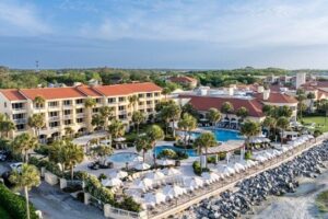 Aerial view of hotel accommodations with pool