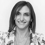 Headshot of women in floral blazer